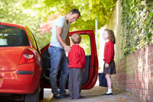 Dad dropping off kids